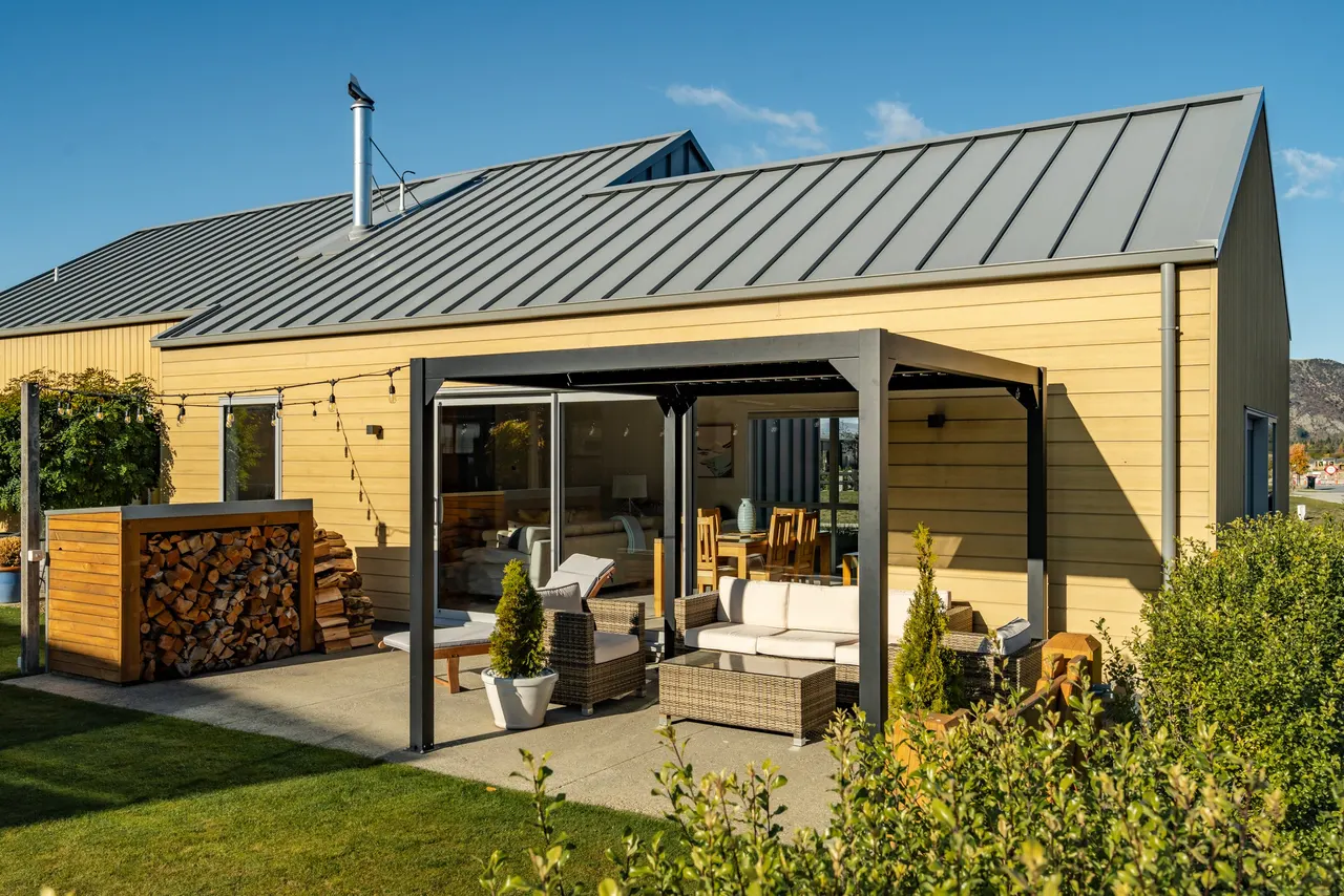 Sheltered outdoor living deck and dining area