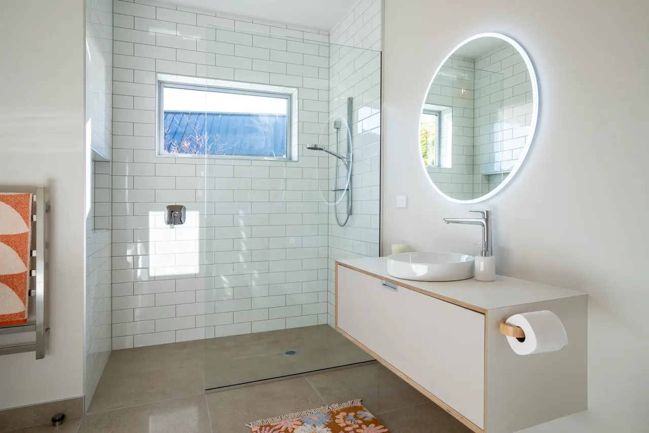Ensuite in natural light with stainless fixtures.