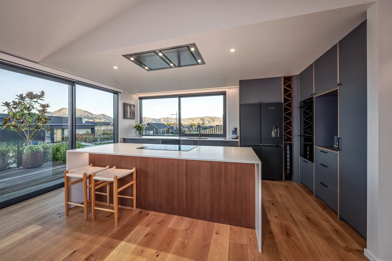 Kitchen island, pantry joinery and adjacent dining area