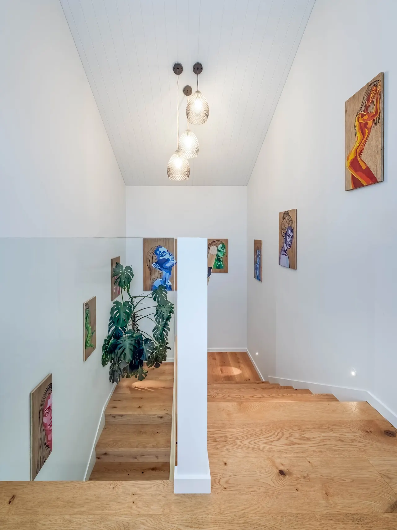 Hardwood staircase with a frameless glass balustrade