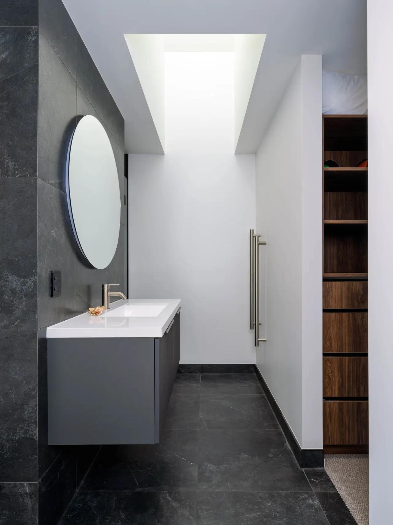 Master ensuite with built-in walk-in wardrobe and skylight